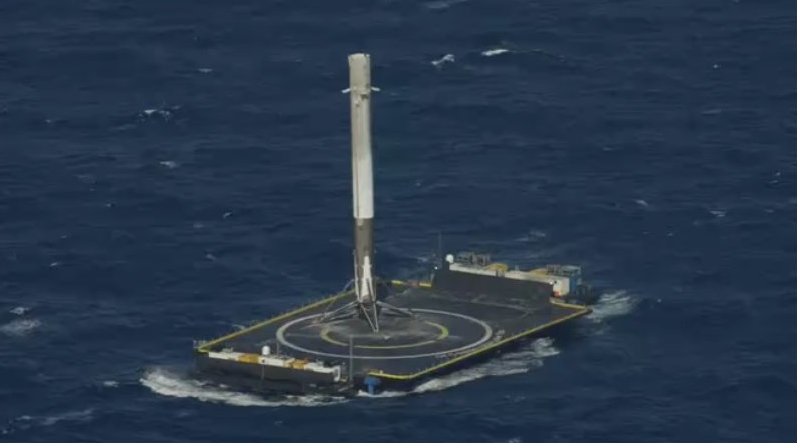 Rocket booster after landing on drone ship